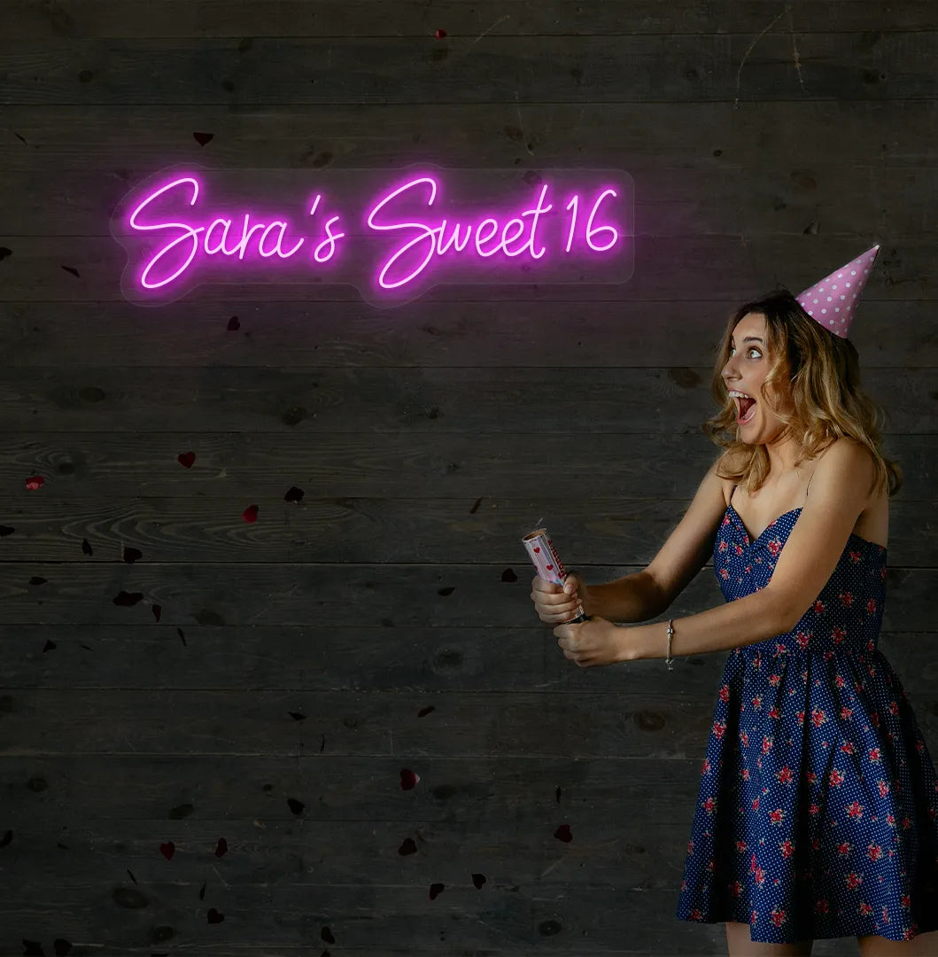 Bright pink Personalized Sweet 16 neon sign mounted on decorative wall.