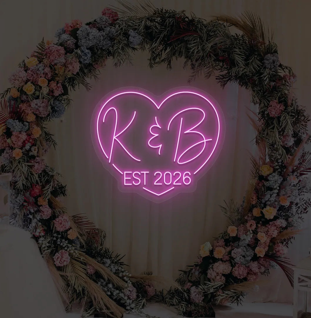 Image of a custom wedding EST neon sign in purple color on aesthetic wall decor.