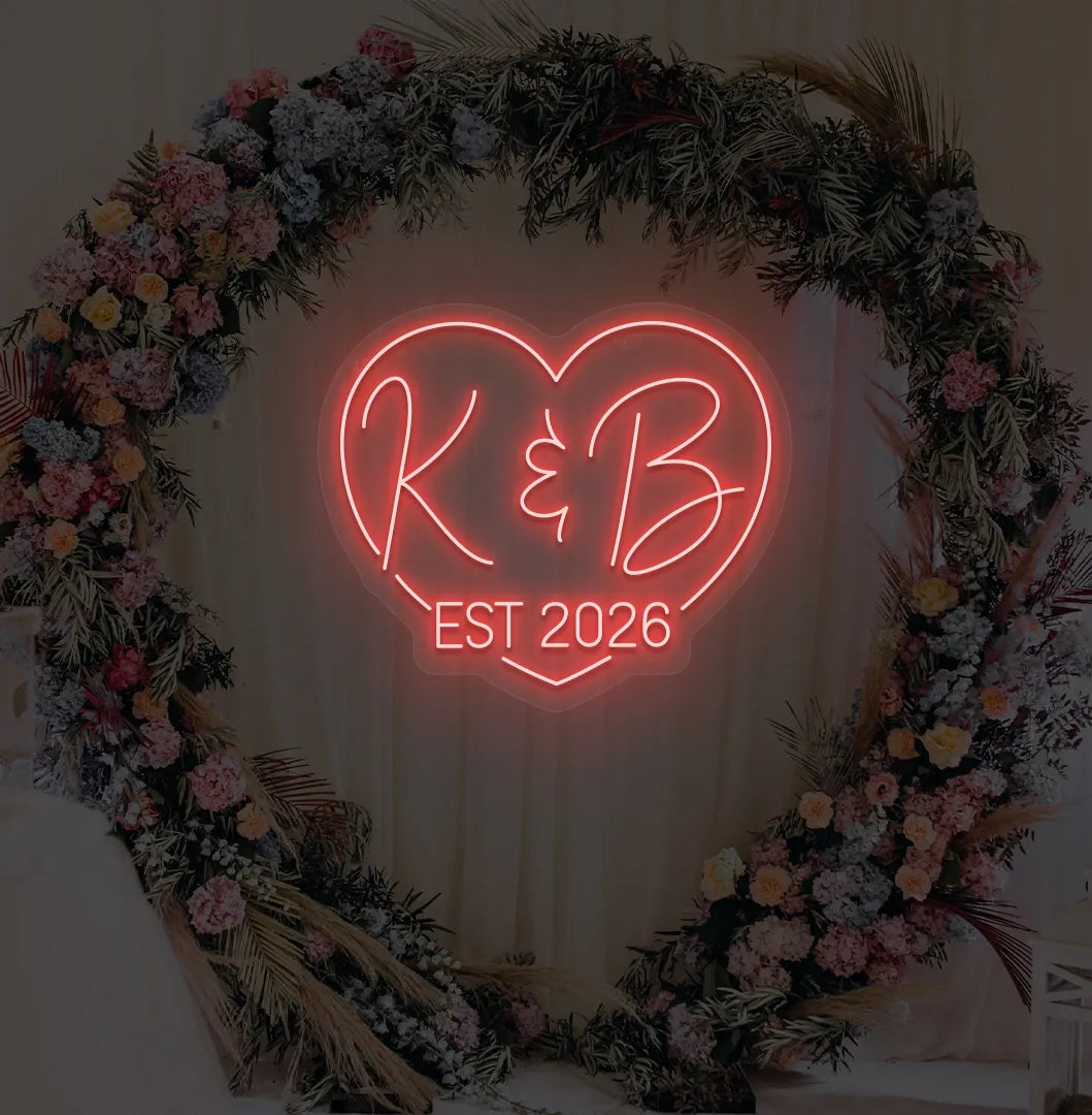 Personalized wedding established neon sign glowing red on decorative wall.