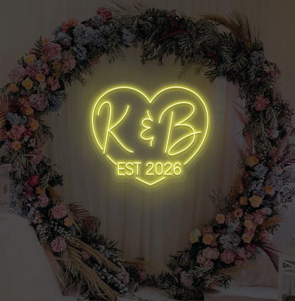 Image of a custom wedding EST neon sign in yellow color on aesthetic wall decor.