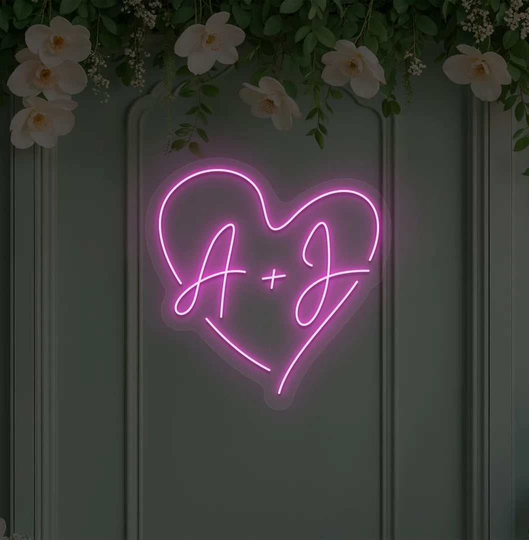 Image of a personalized wedding initials neon sign glowing purple on decorative wall.