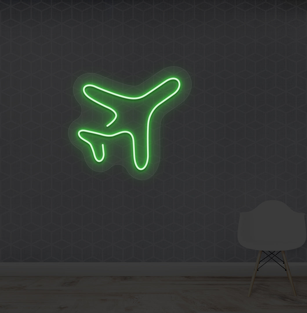 Travel themed wall with plane LED neon sign glowing green.