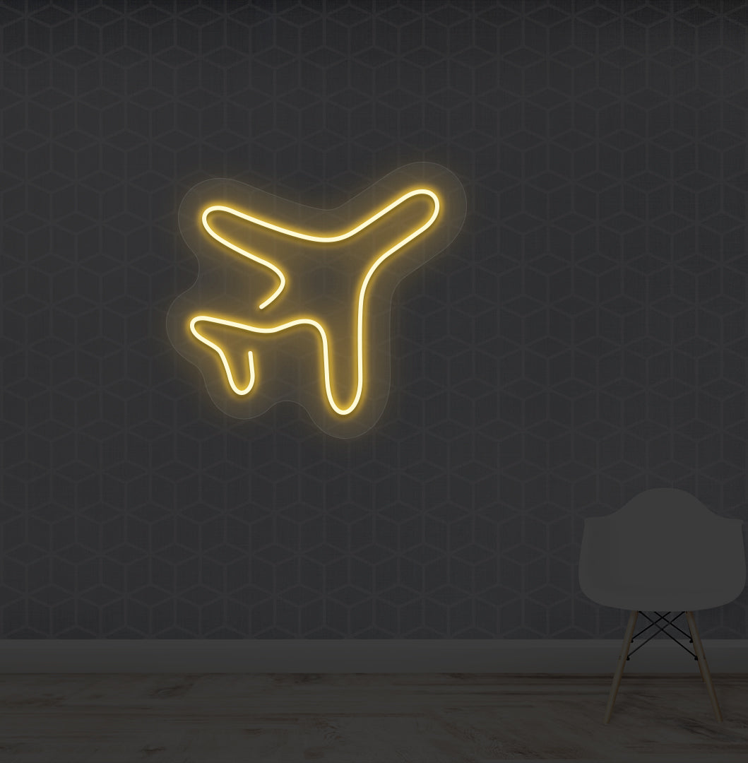 Travel themed wall with plane LED neon sign glowing orange.