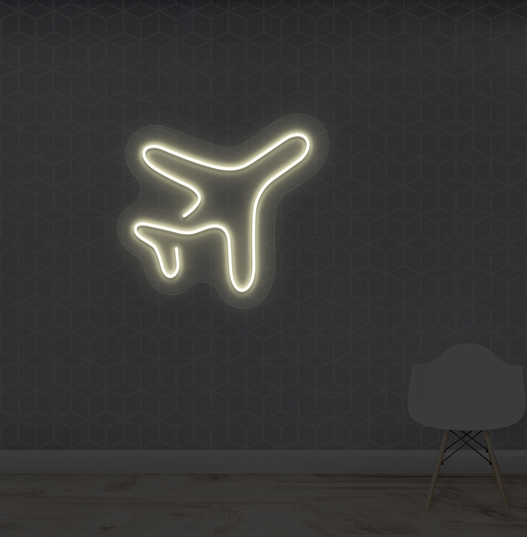 Travel themed wall with plane LED neon sign glowing warm white.