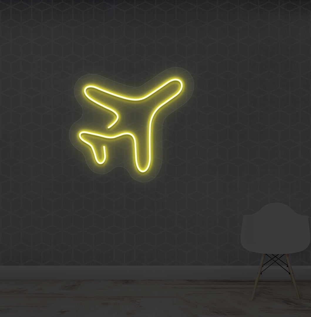 Travel themed wall with plane LED neon sign glowing yellow.