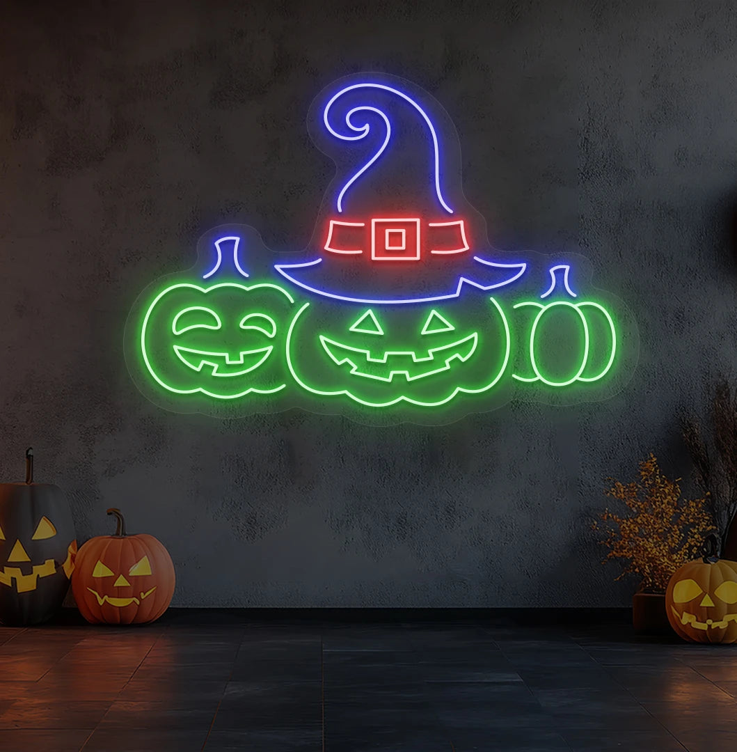 Spooky pumpkins Halloween neon sign in green mounted on room wall.