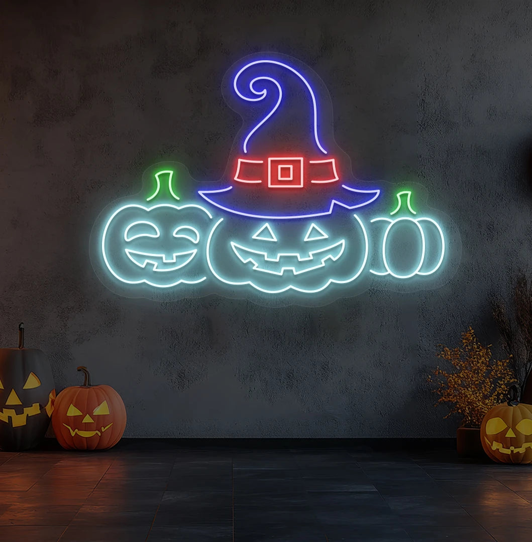 Modern wall decor with pumpkins Halloween neon sign glowing ice blue.