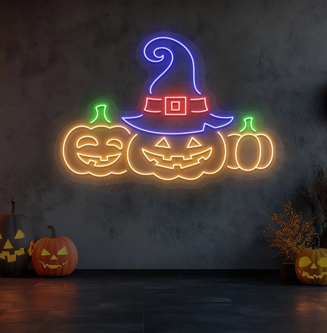 Spooky pumpkins Halloween neon sign in orange mounted on room wall.