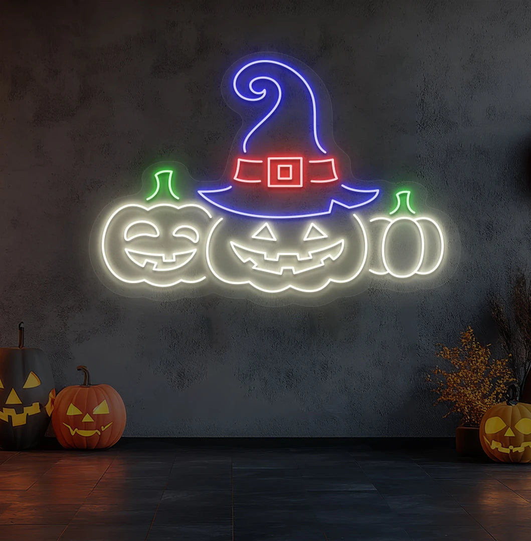 Spooky pumpkins Halloween neon sign in warm white mounted on room wall.