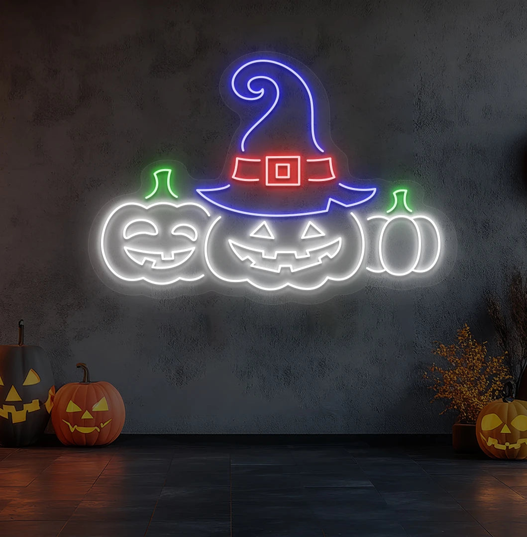 Modern wall decor with pumpkins Halloween neon sign glowing white.