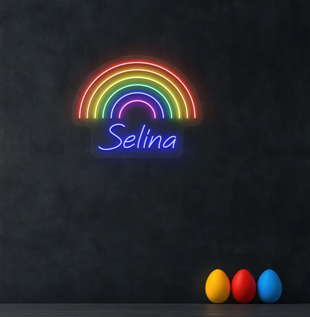 Personalized Rainbow Name neon sign in blue color mounted on modern wall.