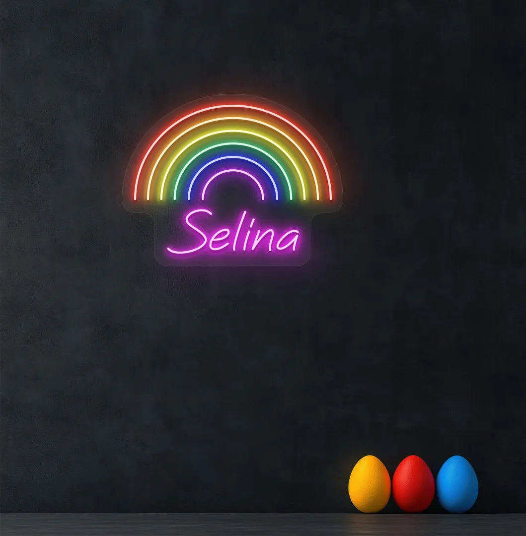 Personalized Rainbow Name neon sign in pink color mounted on modern wall.