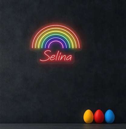 Personalized Rainbow Name neon sign in red color mounted on modern wall.