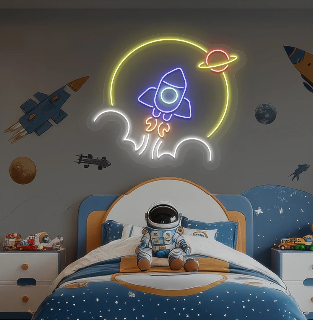 Image of a rocket neon sign in space theme above astronaut toy glowing on kid's room wall in blue color.