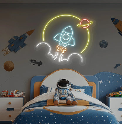 Image of a rocket neon sign in space theme above astronaut toy glowing on kid's room wall in ice blue color.
