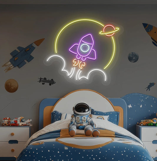 Rocket in space neon sign glowing purple above astronaut toy on kid's bedroom wall.
