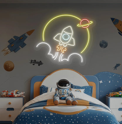 Rocket in space neon sign glowing warm white above astronaut toy on kid's bedroom wall.