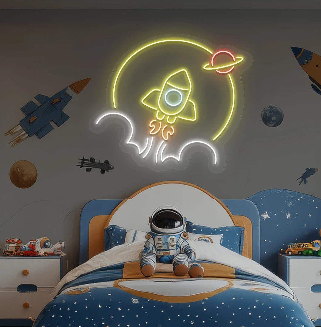 Rocket in space neon sign glowing yellow above astronaut toy on kid's bedroom wall.