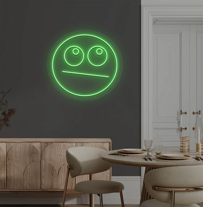 Trendy rolling eyes emoji neon sign in green mounted on aesthetic wall.