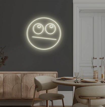 Trendy rolling eyes emoji neon sign in warm white mounted on aesthetic wall.