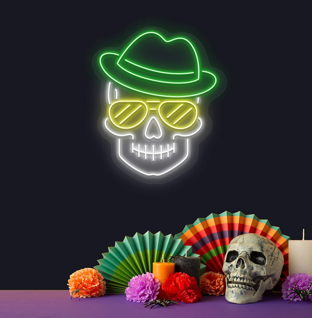 Modern aesthetic wall with skull neon sign glowing green above human skull.