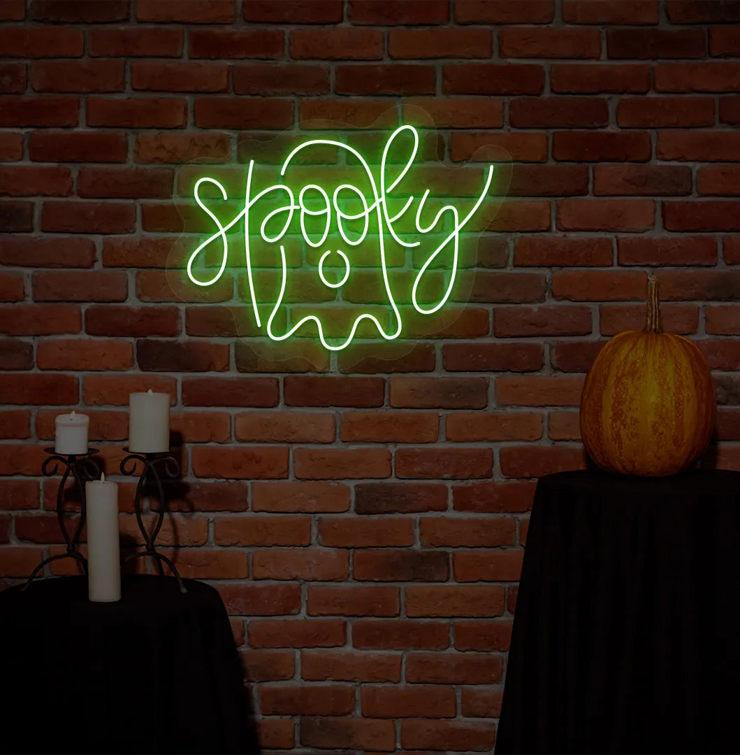 Spooky Green Neon Sign creating an eerie glow on a Halloween themed wall.