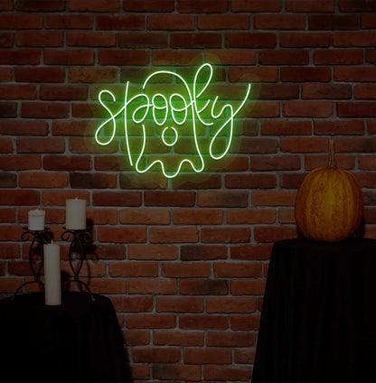 Spooky Green Neon Sign creating an eerie glow on a Halloween themed wall.