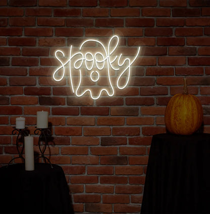 Spooky Warm White Neon Sign creating an eerie glow on a Halloween themed wall.