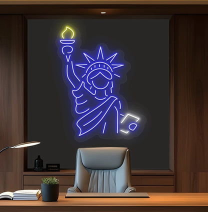 Image of a "Statue of Liberty" neon sign mounted on office wall in blue color.