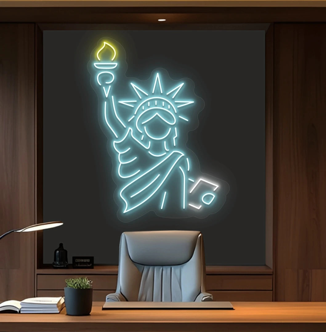 Image of a "Statue of Liberty" neon sign mounted on office wall in ice blue color.