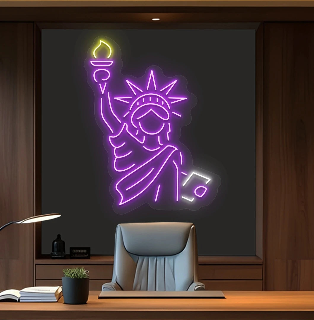 Modern office wall with statue of liberty neon sign glowing purple behind chair.