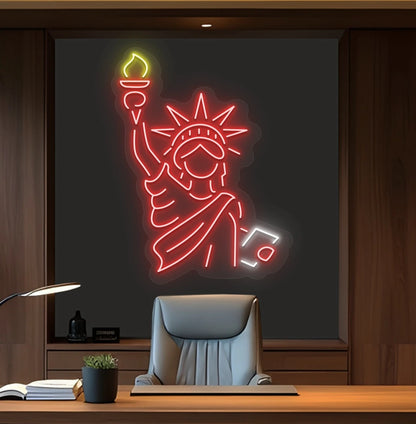 Image of a "Statue of Liberty" neon sign mounted on office wall in red color.