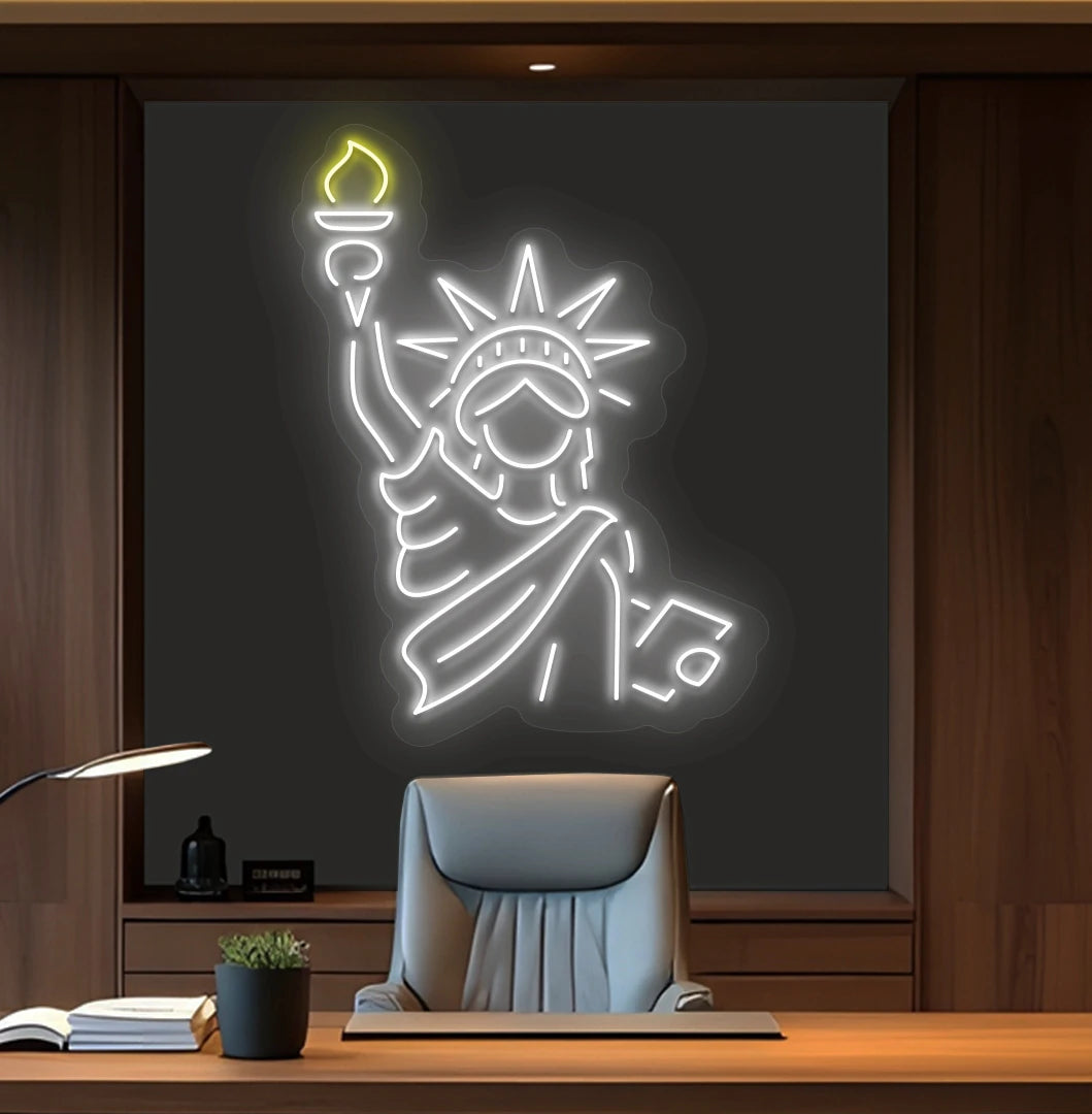 Image of a "Statue of Liberty" neon sign mounted on office wall in white color.
