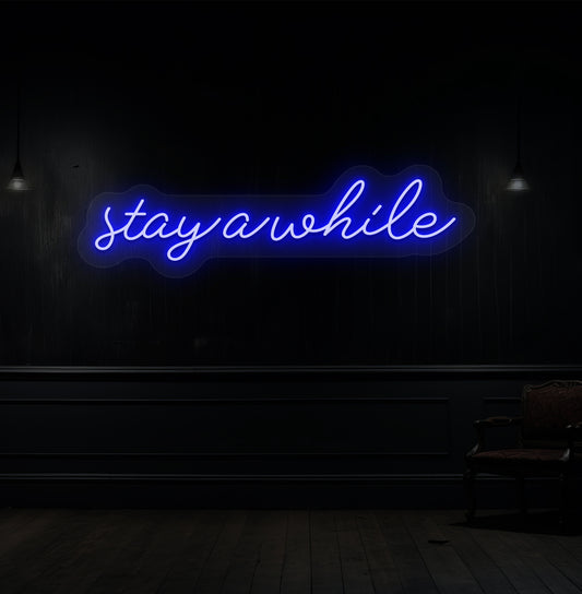 Image of a "stay a while" LED neon sign hanging on a wooden wall in blue color. 