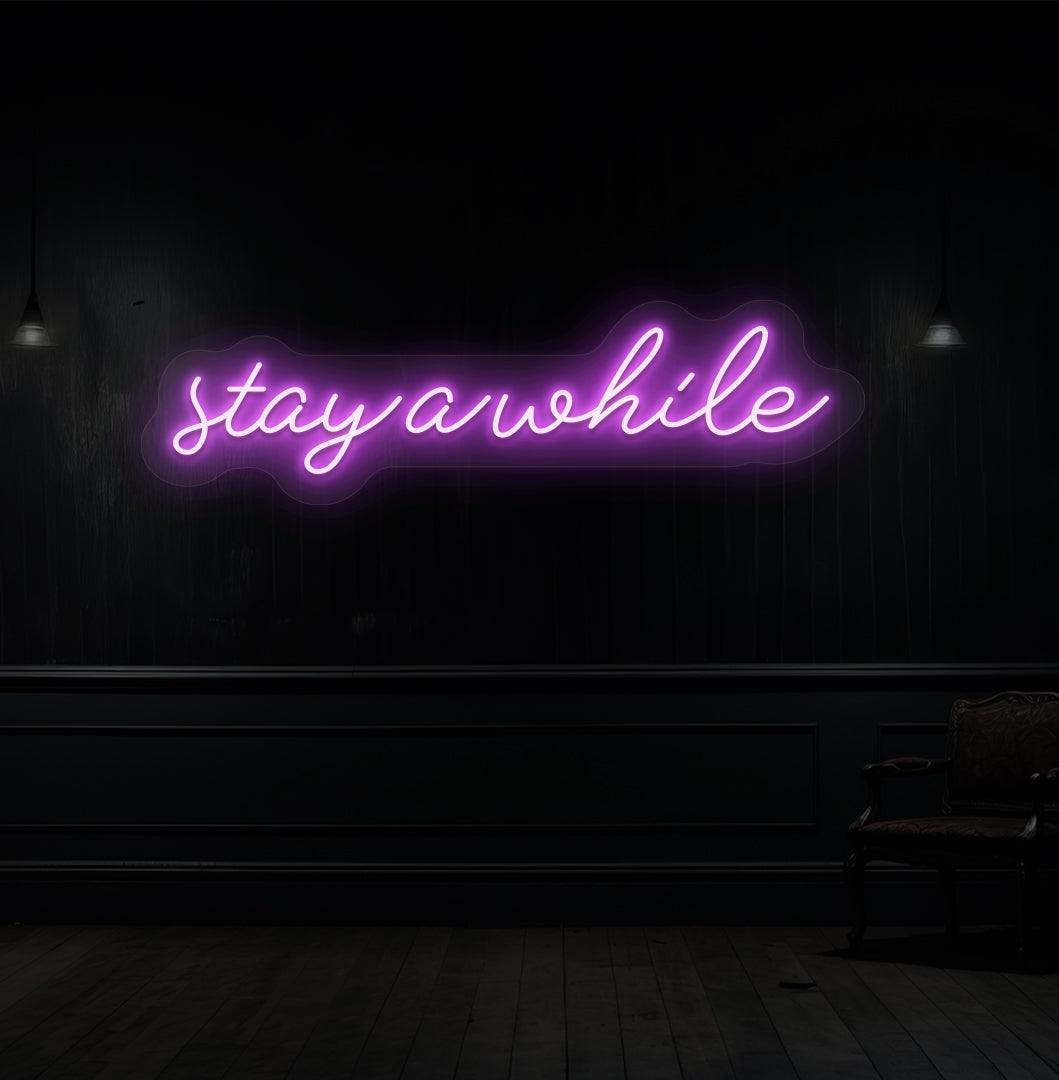 Image of a "stay a while" LED neon sign hanging on a wooden wall in purple color. 