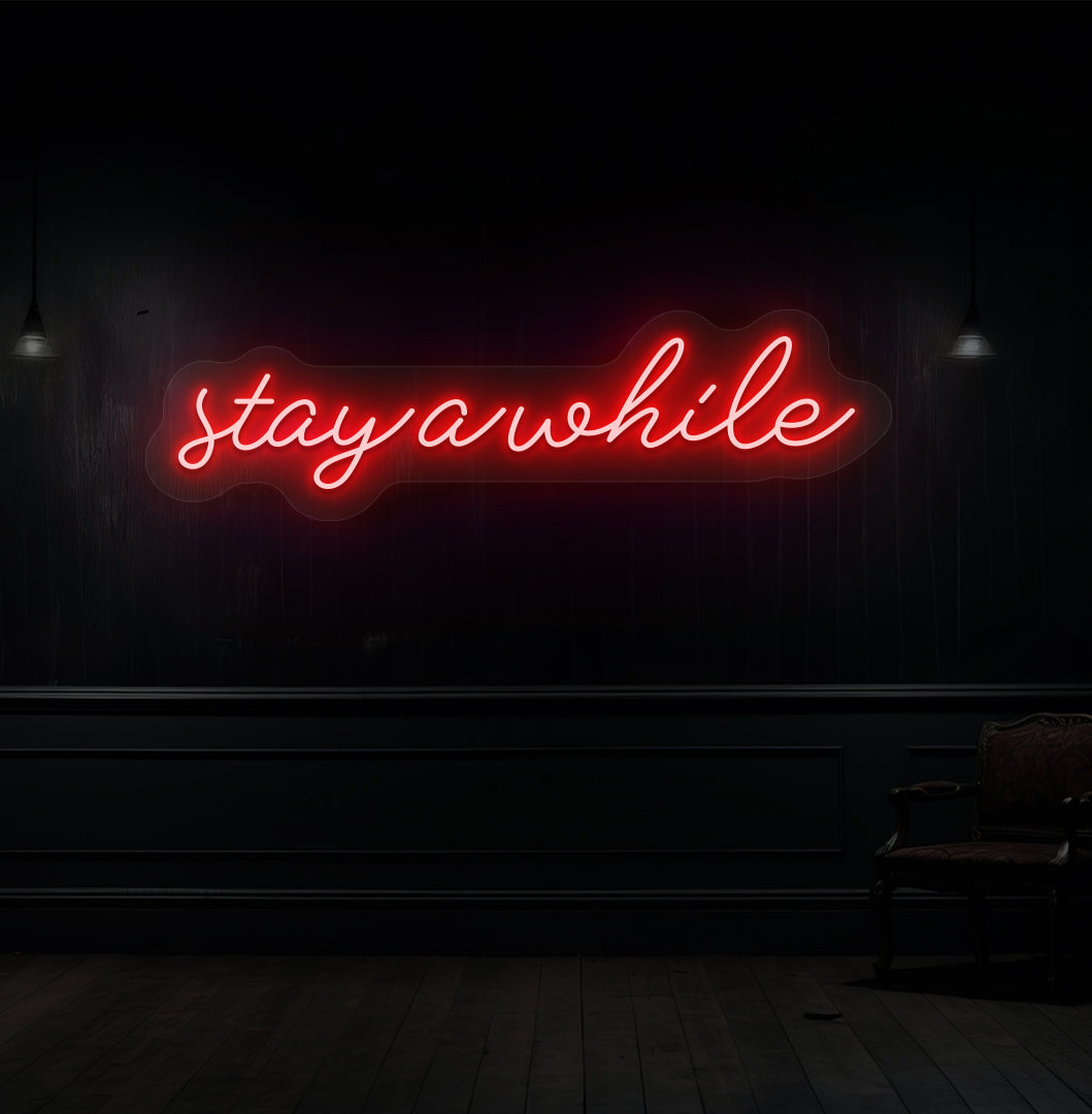 Decorative red neon sign "stay a while" on a wood panel wall. Perfect for living room & hallway décor, cafés, lounges, and reception spaces.
