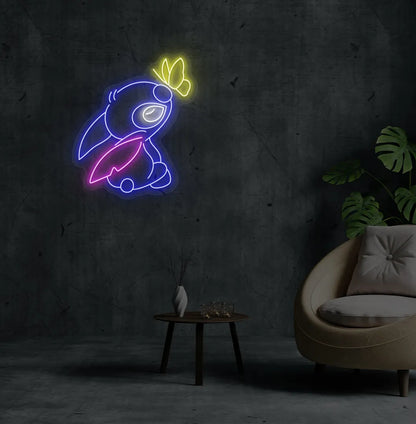 Stitch-inspired blue neon sign glowing on decorative wall.