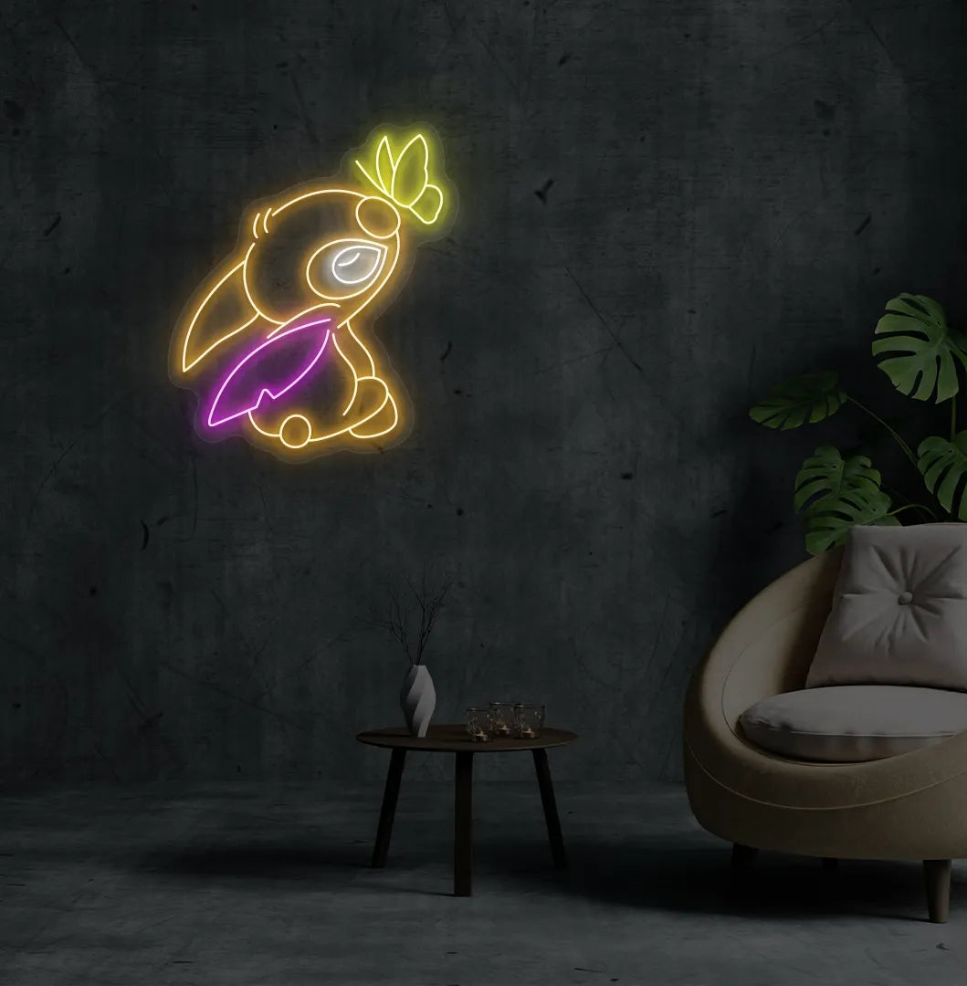 Image of a Cute Stitch neon sign mounted on modern bedroom wall in orange color.