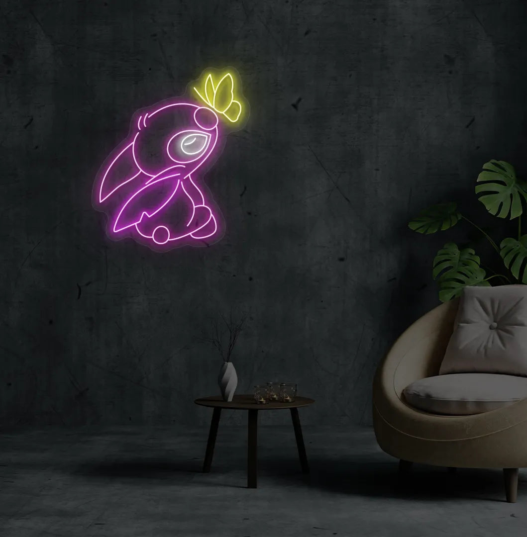 Image of a Cute Stitch neon sign mounted on modern bedroom wall in purple color.