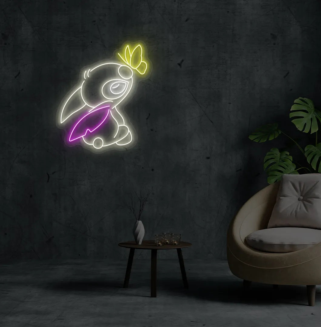 Image of a Cute Stitch neon sign mounted on modern bedroom wall in warm white color.