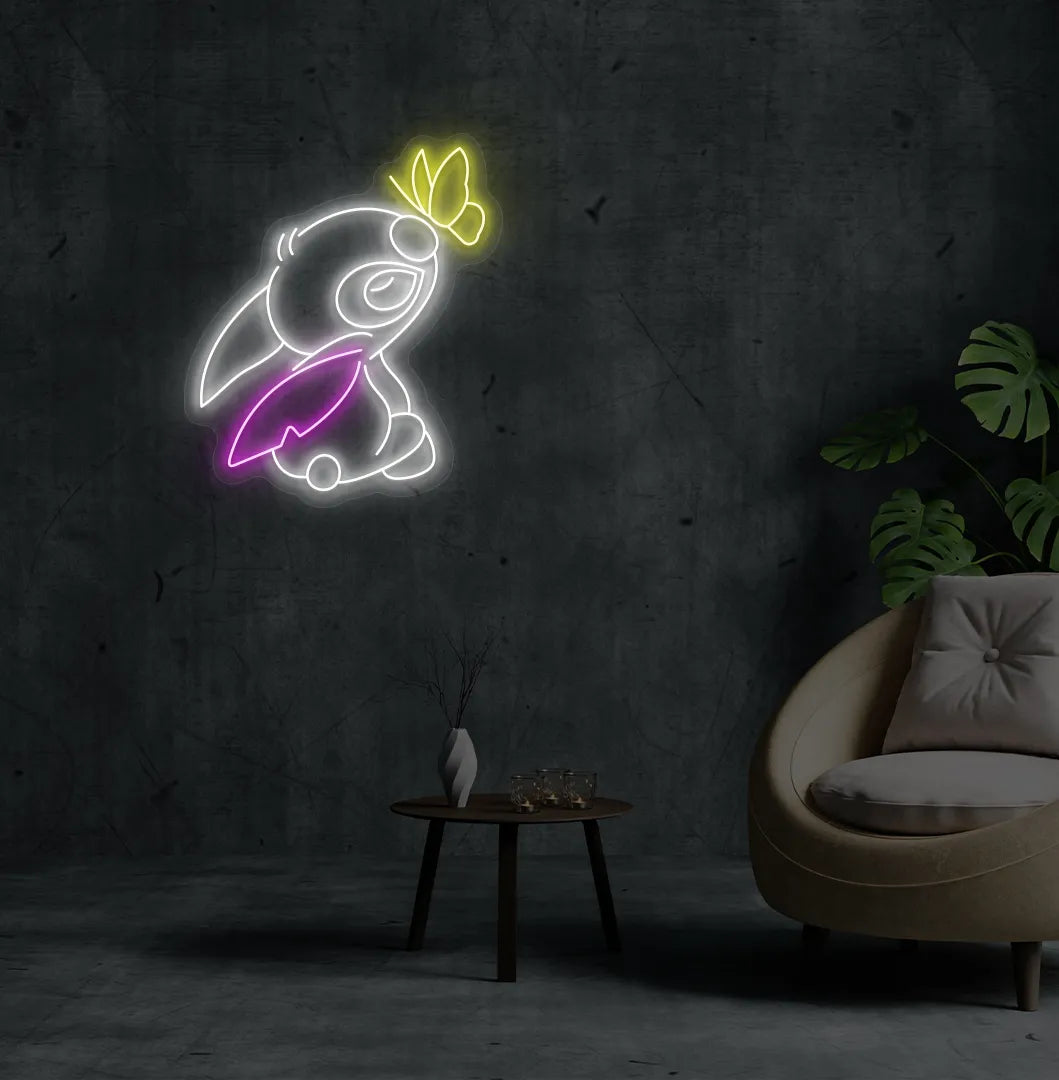 Stitch-inspired white neon sign glowing on decorative wall.