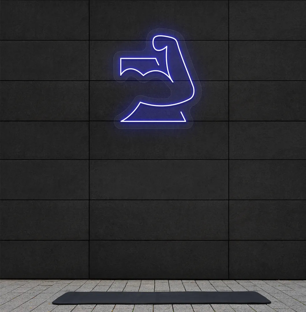 Image of a stylish strong body neon sign in blue mounted on gym wall.