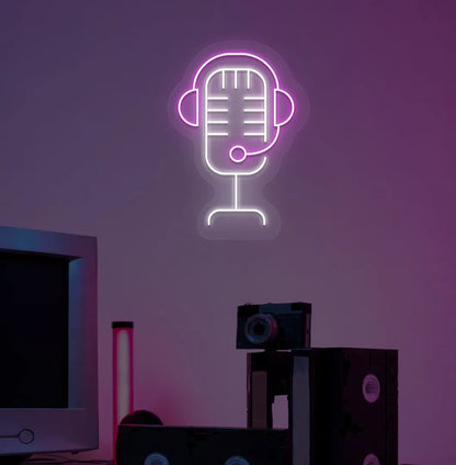 Image of an aesthetic gaming room wall with studio MIC neon sign glowing pink.