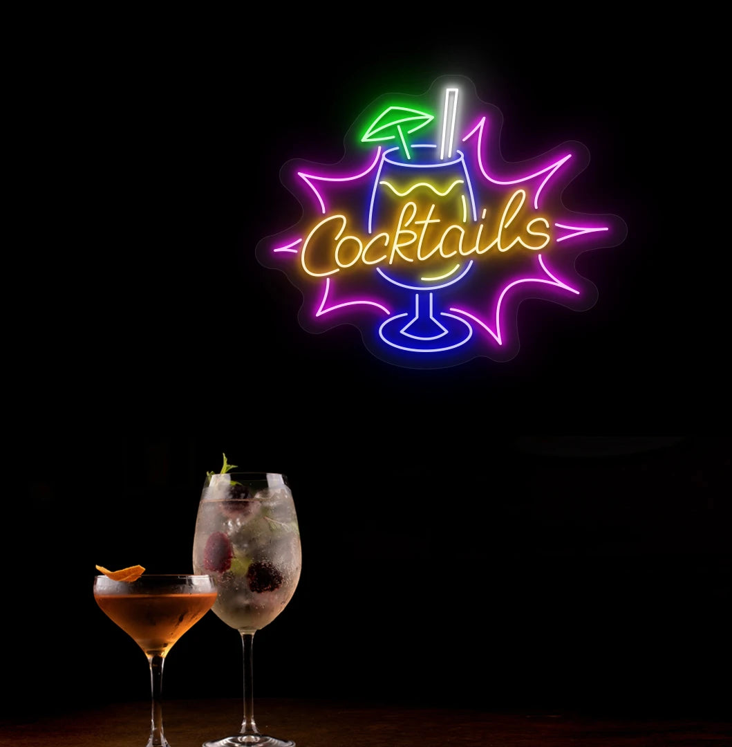 Modern wall decor with cocktail text and glass neon sign glowing orange.