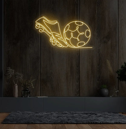 Stylish football with shoe neon sign mounted on aesthetic wall in orange color.