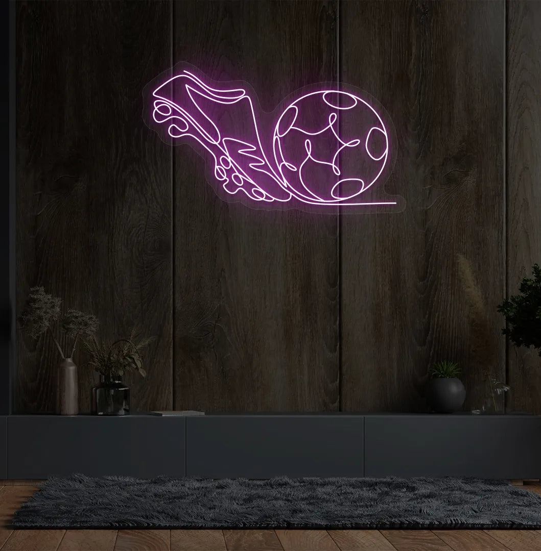 Stylish football with shoe neon sign mounted on aesthetic wall in pink color.