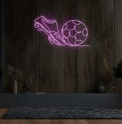 Stylish football with shoe neon sign mounted on aesthetic wall in pink color.