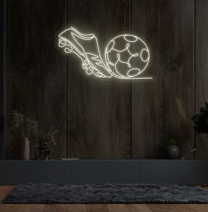 Stylish football with shoe neon sign mounted on aesthetic wall in warm white color.