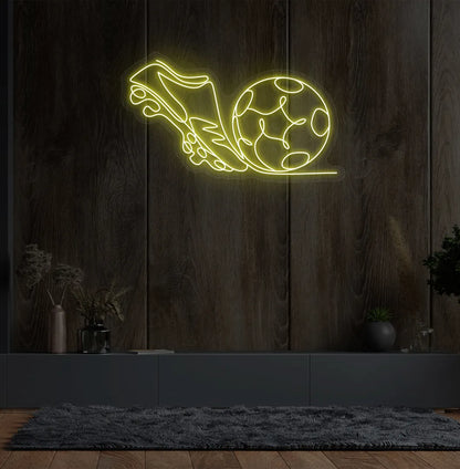 Stylish football with shoe neon sign mounted on aesthetic wall in yellow color.