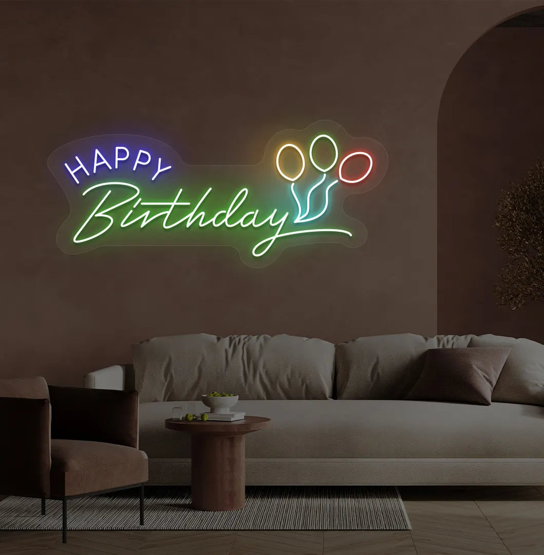 Trendy Happy Birthday neon sign in green mounted on decorative party wall.